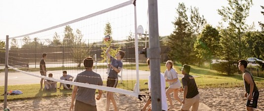 People playing beach volleyball